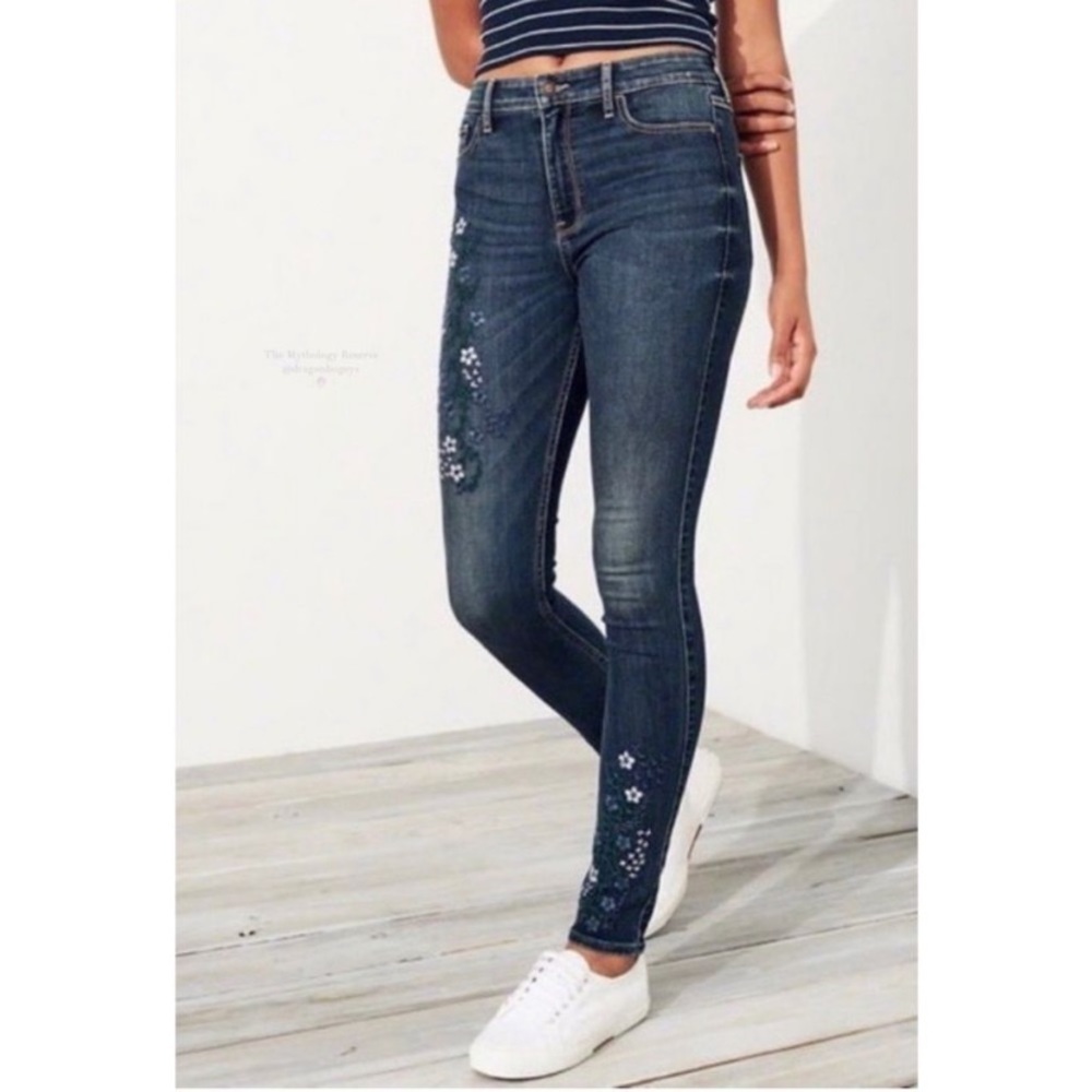 Hollister flower-embroidered high-rise dark wash skinny jeans.